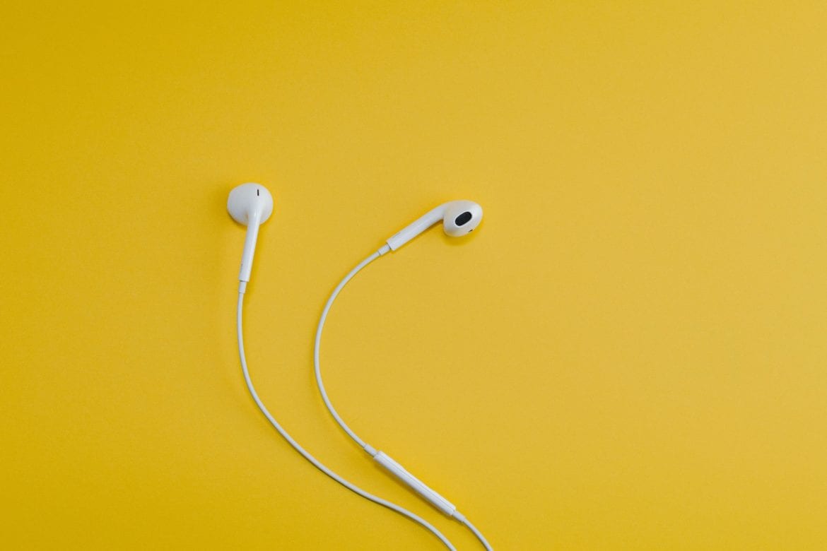 earbuds on yellow background