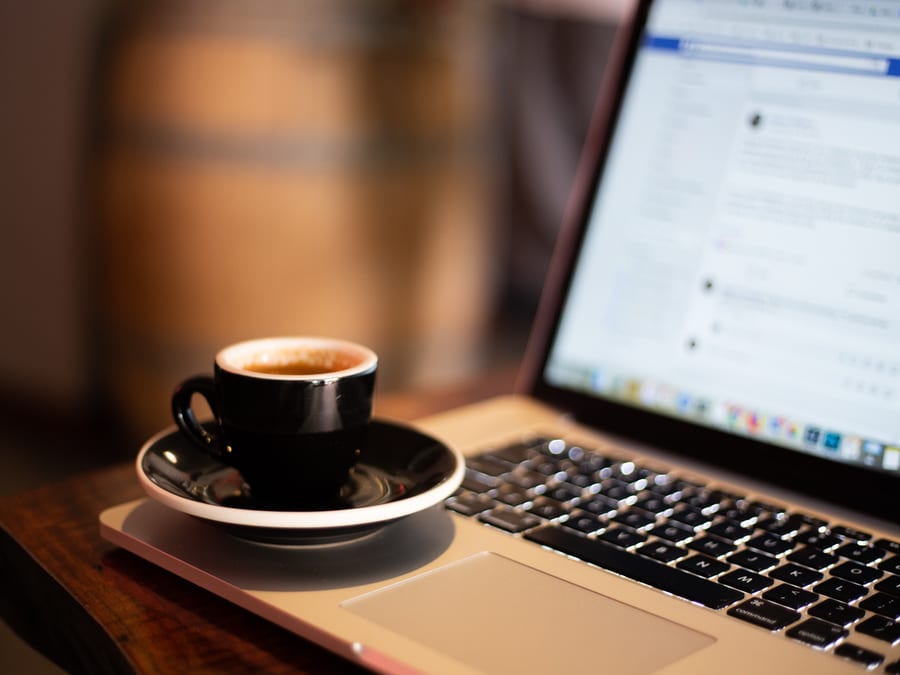 espresso cup on laptop