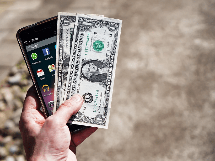 mobile phone and two dollar bills